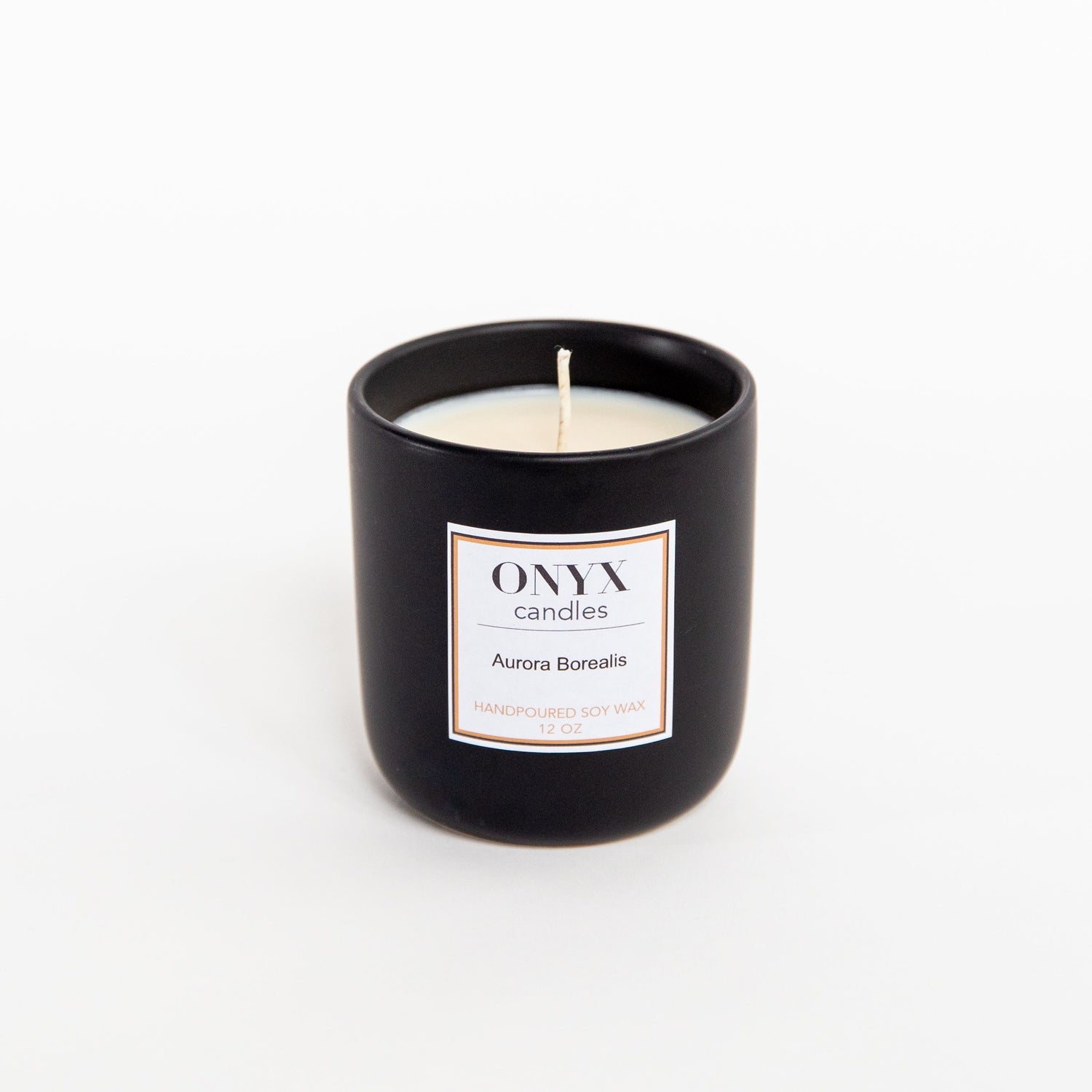 Pictured is the 12 oz matte black ceramic candle, in the scent Aurora Borealis