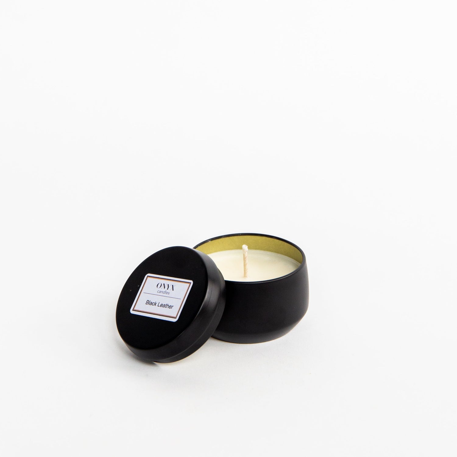 Pictured is the 4 oz matte black tin candle, in the scent Black Leather