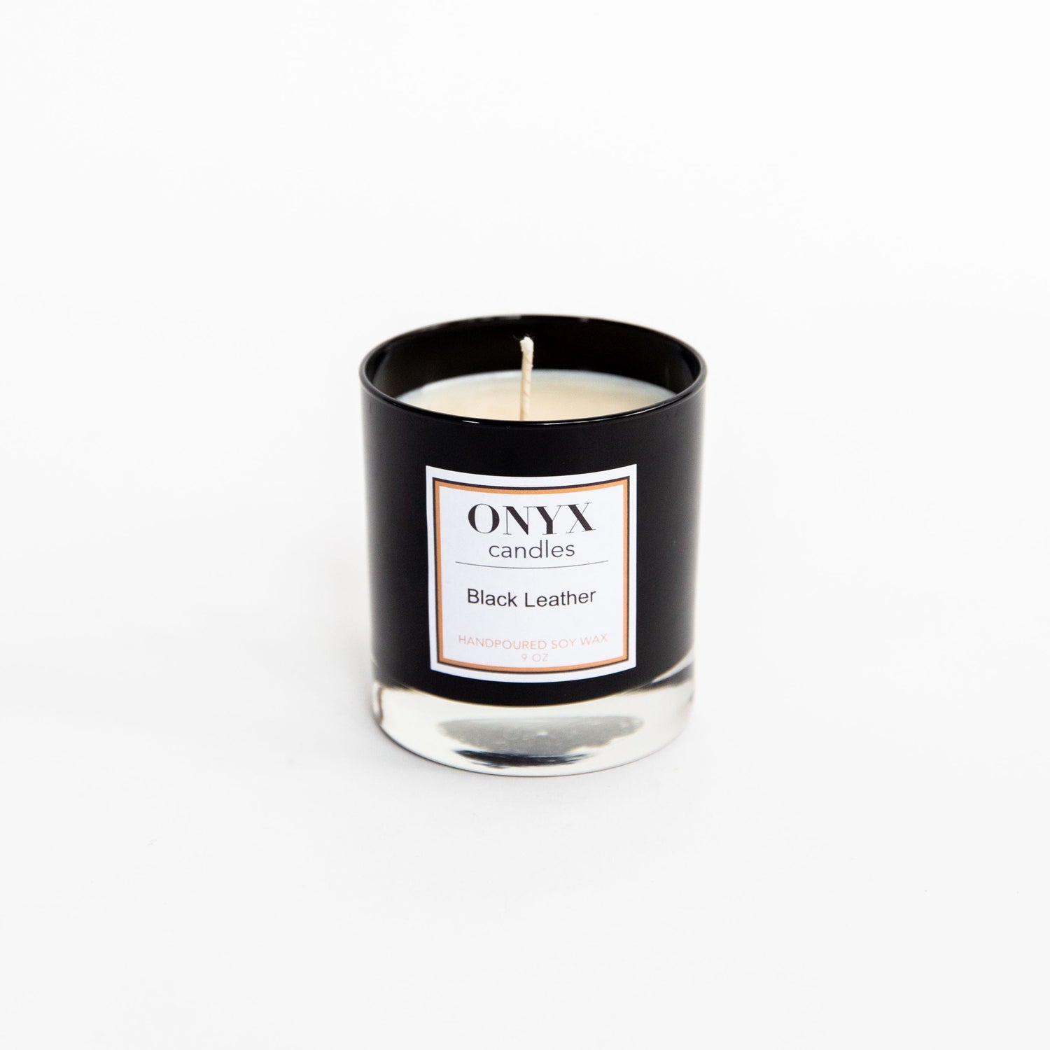 Pictured is the 9 oz black glass candle, in the scent Black Leather