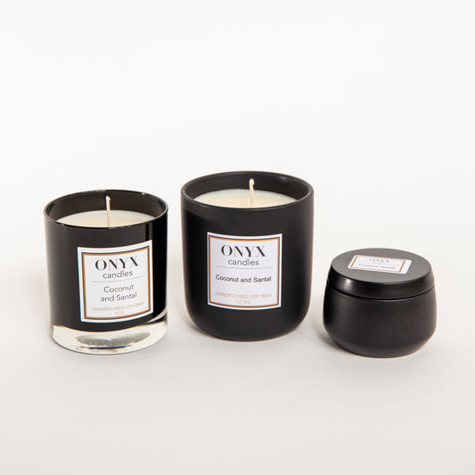 Pictured are three size variants of Onyx candles in the scent Coconut and Santal