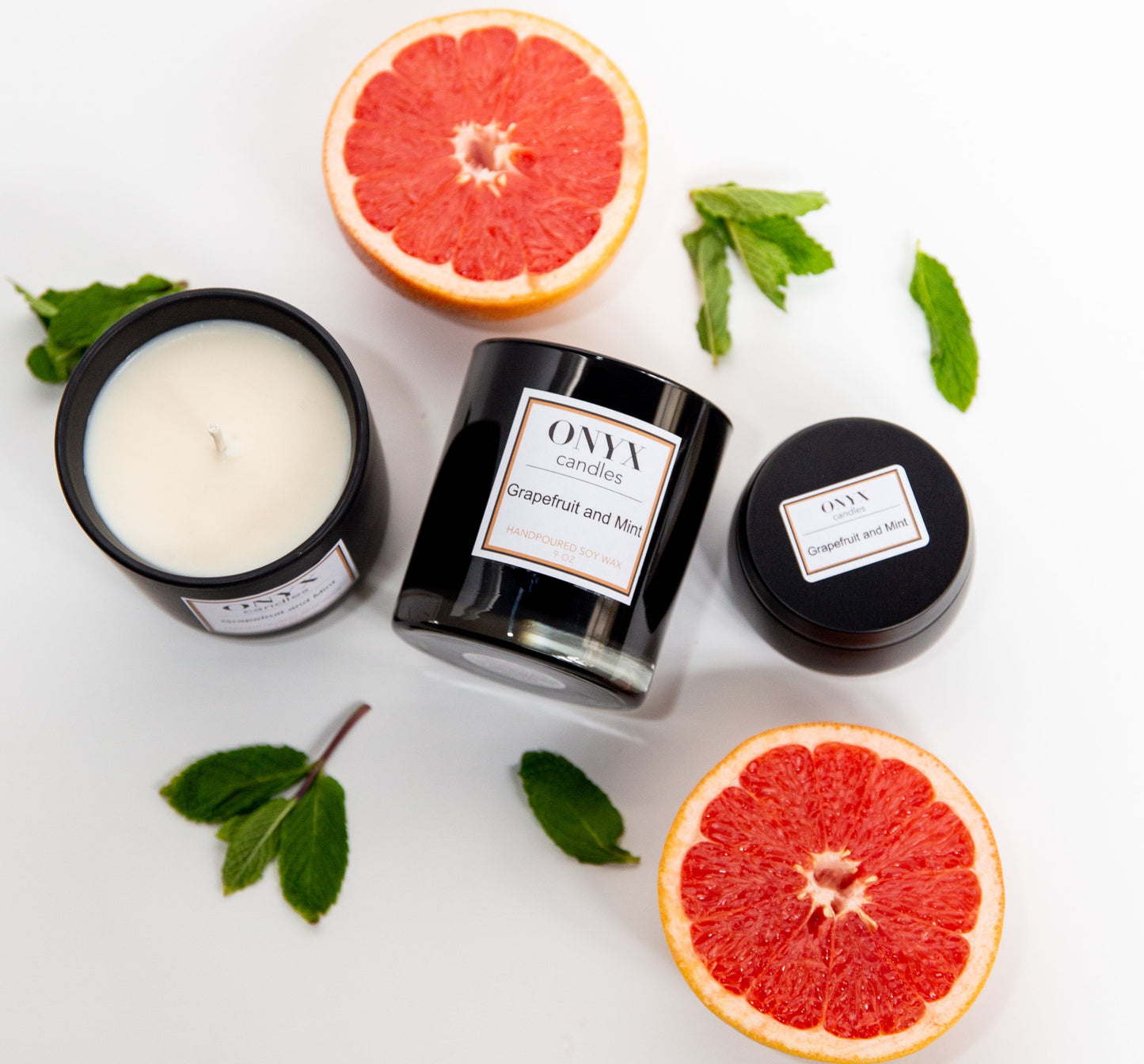 Grapefruit and Mint candle collection, shown with fresh grapefruits and mint leaves