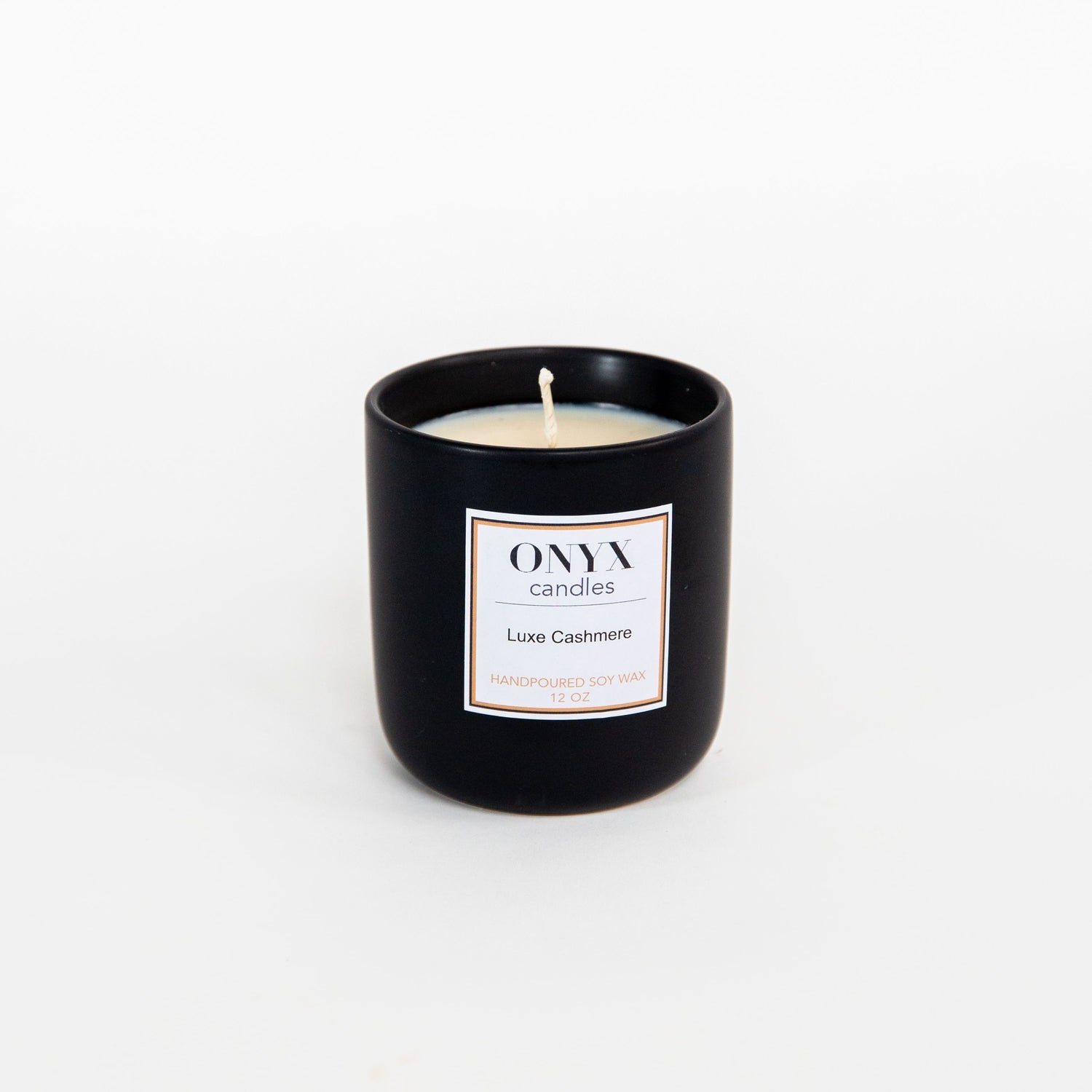 12 oz matte black ceramic jar, candle scented in Luxe Cashmere