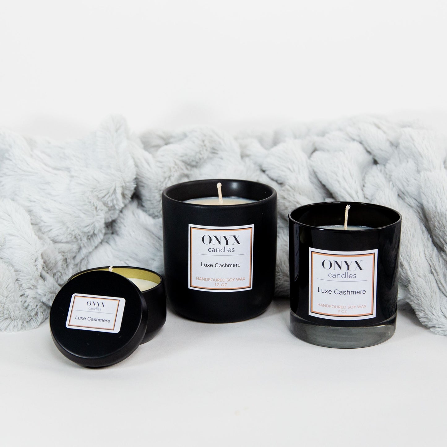 three size variants of Onyx candles scent Luxe Cashmere