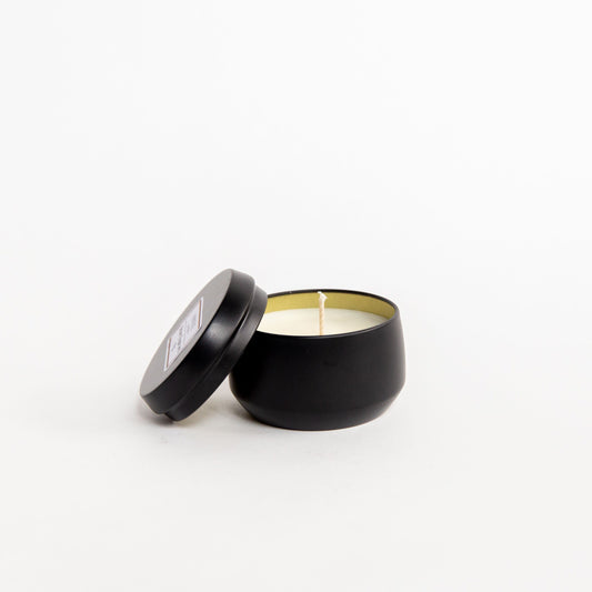 Pictured is a 4 oz matte black tin candle in the scent of Brown Sugar and Fig
