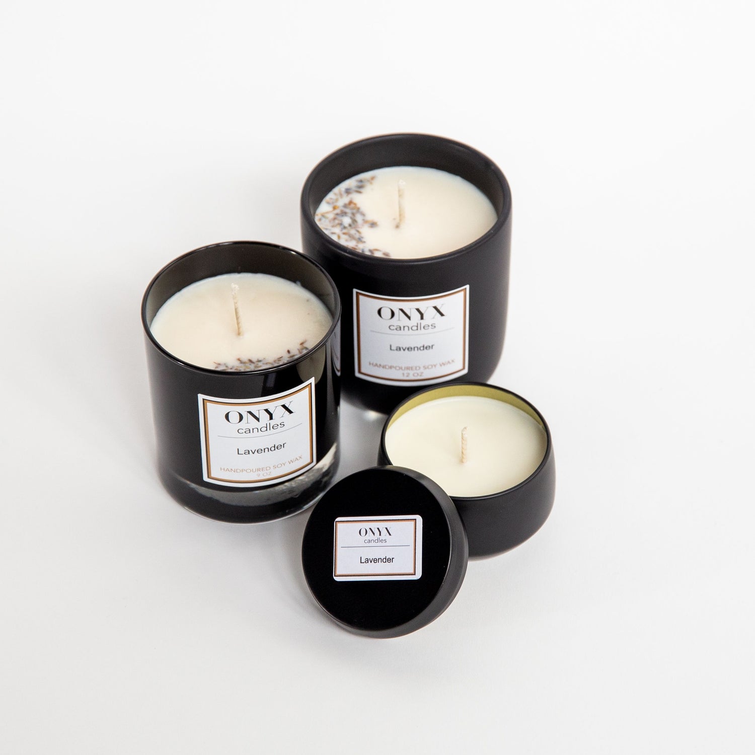 Pictured are three size variants of Onyx candles in the scent Lavender