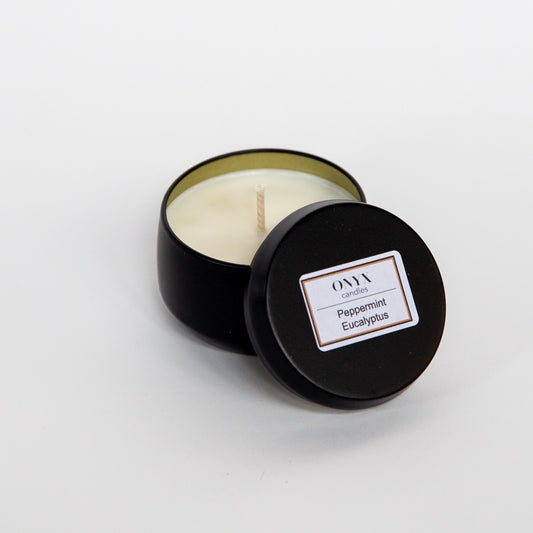 This image shows a close up view of the 4oz matte black tin option for the scent Peppermint Eucalyptus