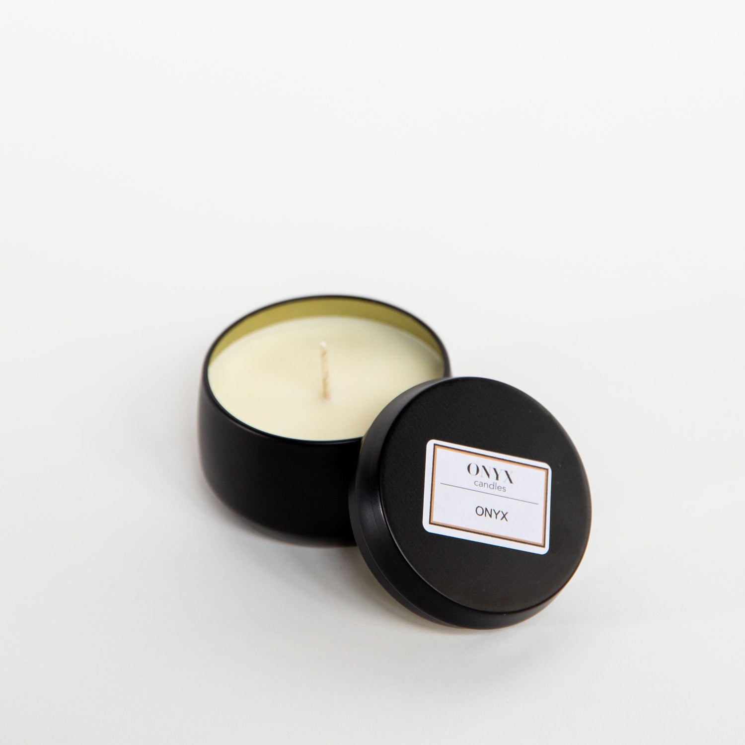 Onyx candles signature scent in a 4oz matte black tin