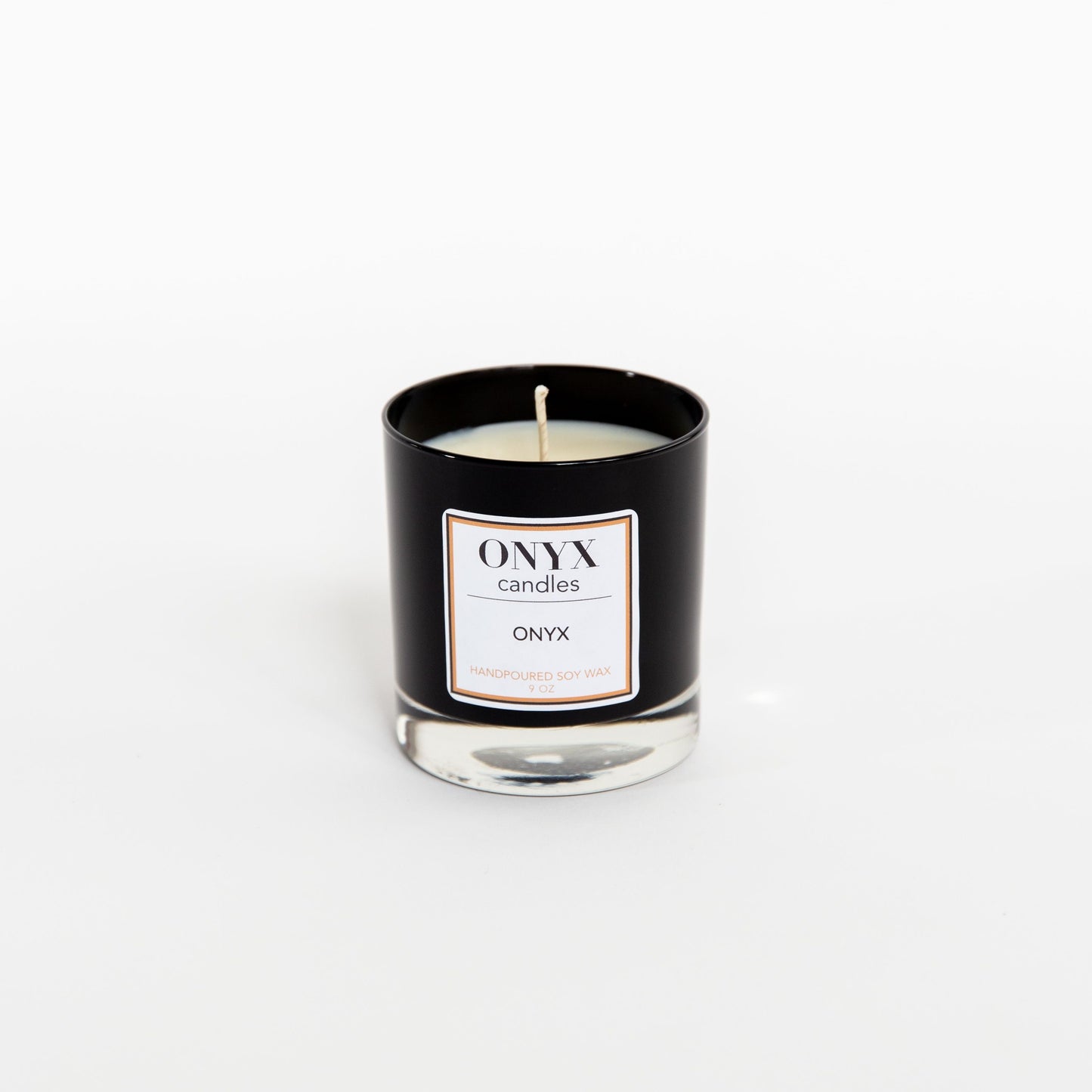 Onyx signature scent candle in a 9oz black glass jar