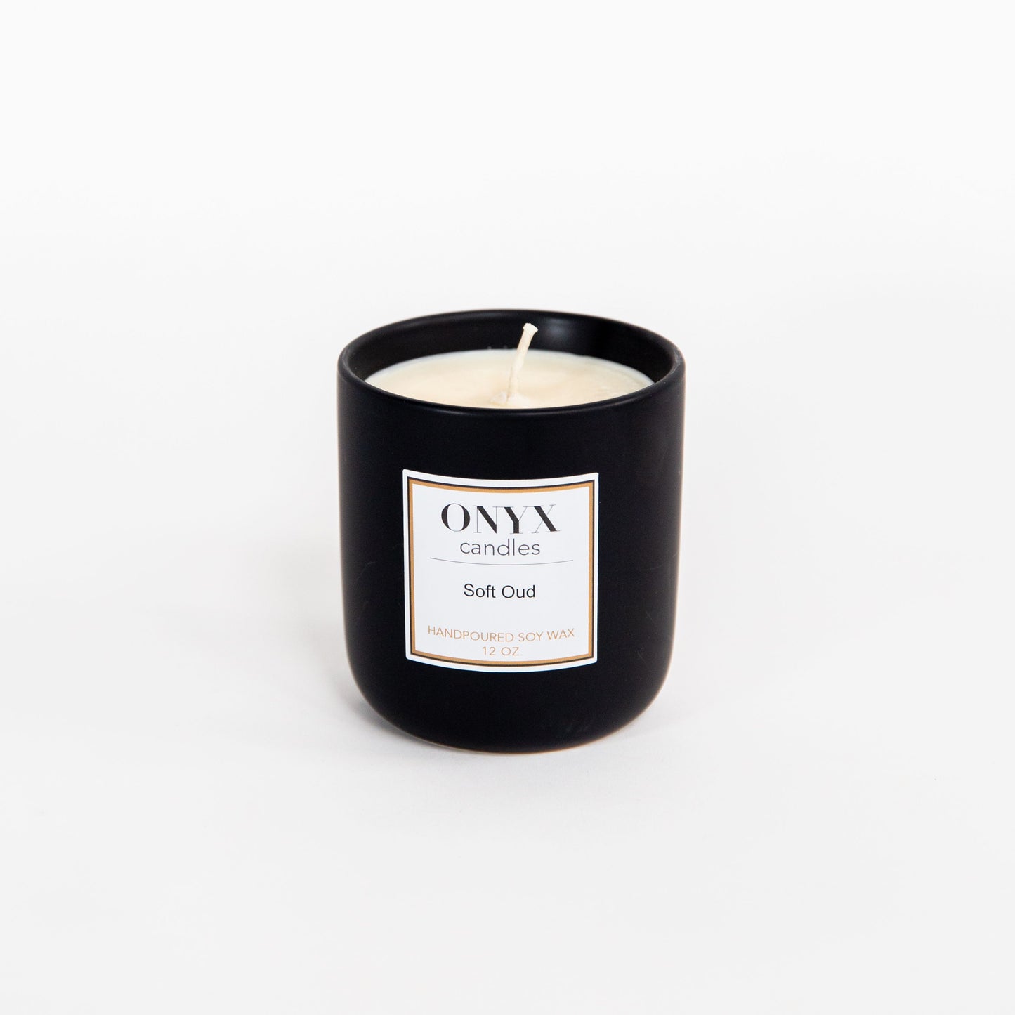 12 oz matte black ceramic candle in the scent Soft Oud