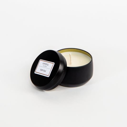 Soft Oud scented candle in a 4 oz matte black tin